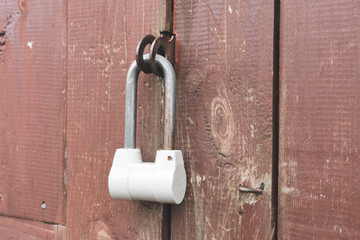 padlock close-up at the entrance, the concept of reliable protection of the house