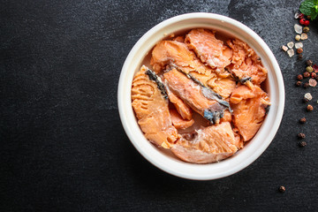 canned salmon, fish preserves seafood in tin can menu concept background. top view. copy space for text ketogenic diet, paleo or pescatarian