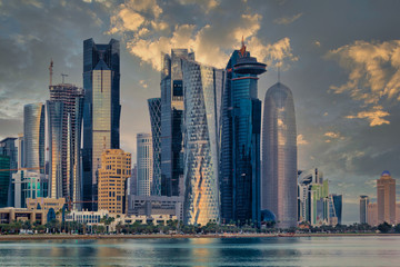 Doha Qatar skyline sunset view showing financial district in West Bay with modern skyscrapers ,...