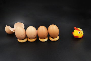 Chicken eggs waving their hands and with different expressions and emotions run for the hatched...