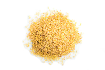 Heap of bulgur isolated on white background. Top view, close up.