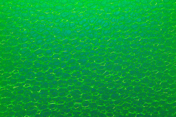 Photo of a synthetic washcloth - processed with changing color shades. 