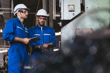 Group of Industrial factory maintenance engineers inspect relay protection system of machinery....