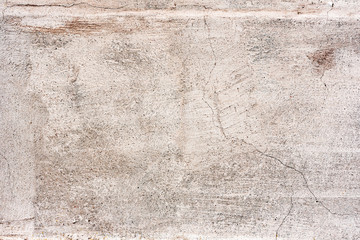 Texture of a concrete wall with cracks and scratches which can be used as a background