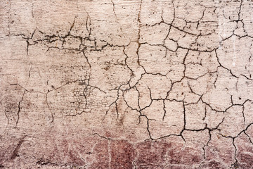 Fototapeta premium Texture of a concrete wall with cracks and scratches which can be used as a background