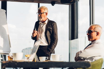 Business man coach speaker wear suit give blank flipchart presentation, Speaker presenter...