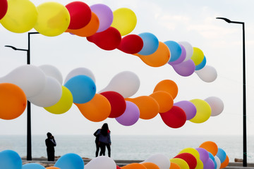 Colorful balloons and people view