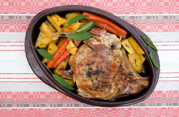 Roasted lamb meat with potatoes and carrots, top view. Gourmet roast lamb