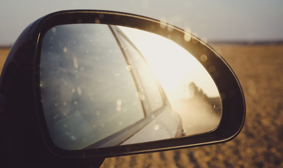 Road Dust in a Car Mirror