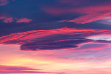 Dramatic sky background in purple, pink and orange hues. Abstract natural sunset skies skyscape,...