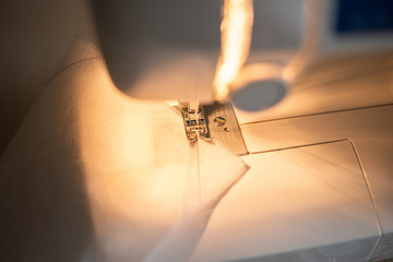 home-made masks; hand-made face masks; spunbond material is sewn with a sewing machine