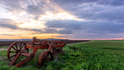 old farm tractor in field