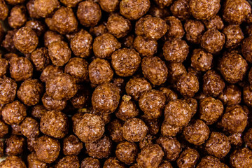 Texture of chocolate cereal balls for the background