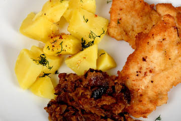fried cabbage with dried mushrooms, boiled potatoes with dill and breaded pork tenderloin