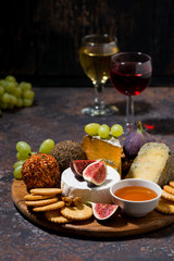 cheese, crackers and fruits, delicious wine snacks, vertical