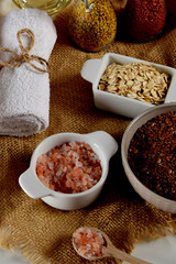 a bowl full of linseed in the company of other seeds for the production of homemade body cosmetics
