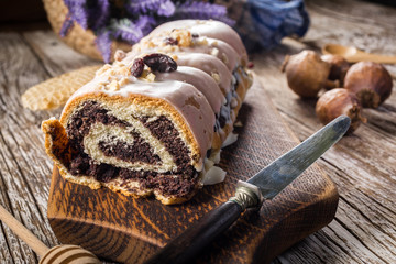 Poppy seed strudel with icing.