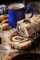 Poppy seed strudel with icing.