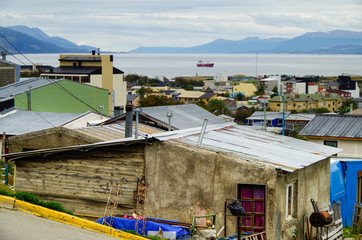 Elevated view over houses and city of Ushuaia, Patagonia in Argentina with colorful roofs and...