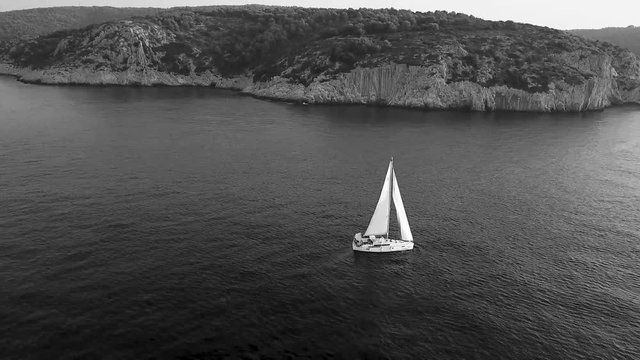 lonely sailing boat on the ocean of croatia, sailing boat on the ocean black and white