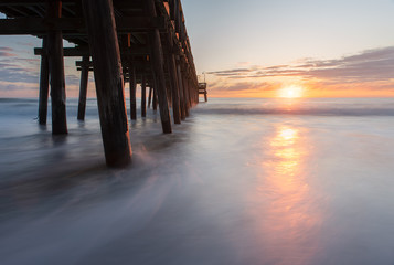 Long exposure photography of sunrise at the Sandbridge Fishing Pier in Virginia Beach
