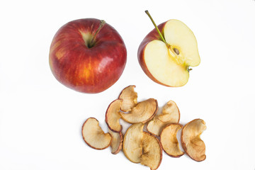 Ripe red apple lying on white  background with dry apple, a new crop, dietary wholesome, healthy food.