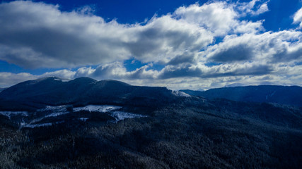 Carpathian mountains mountain range pine forests coniferous mountain tops winter snow aerial photography