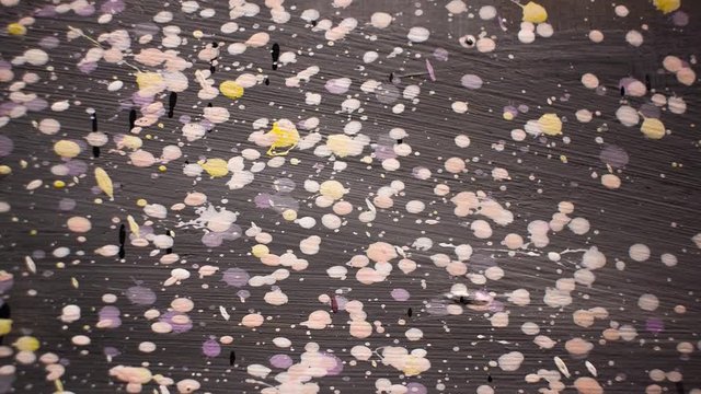 Multi-colored splashes and spots. Stop motion animated background.