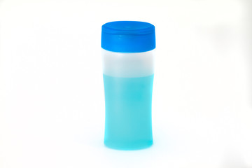 Bottle of blue alcohol gel with white background.  covid-19 prevention.
