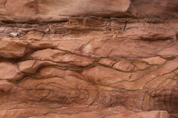 Natural texture of red rocks. Colored canyon, Egypt, the Sinai Peninsula.