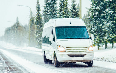 Minivan and cars in road in winter Rovaniemi reflex