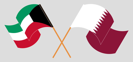 Crossed and waving flags of Kuwait and Qatar