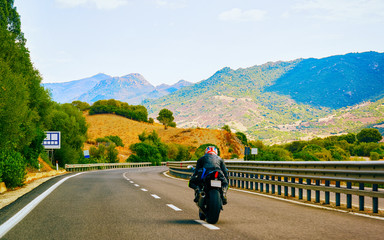 Motorcycle at road in Costa Smeralda reflex