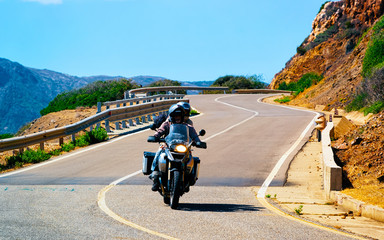 Motorcycle in road in Costa Smeralda reflex