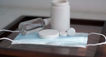 Set for flu treatment during coronavirus quarantine. blister of tablets lies on protective...
