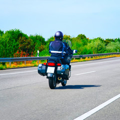 Motorbiker in road in Switzerland reflex