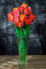 Bouquet of red tulips in a vase. Bouquet of spring flowers. Tulips