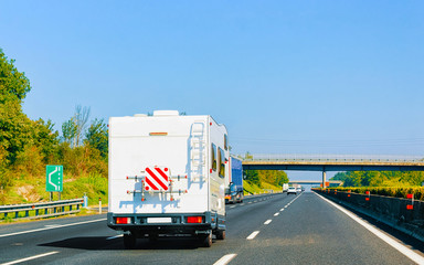 RV Caravan Car on Road Camper and motorhome Italy reflex