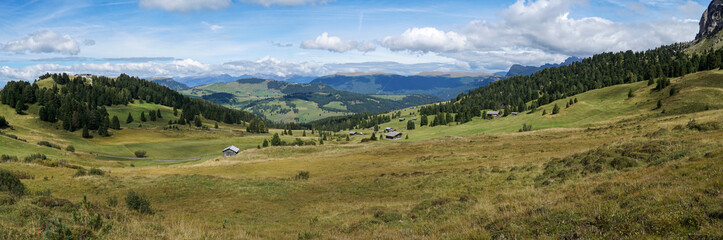 Fototapeta premium Stunning panoramic view: The famous Alp de Siusi - Seiseralm in South Tyrol. Also view to Rosengarten Group and Mountain Sciliar