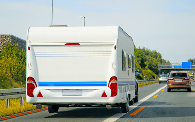 Caravan on highway at Switzerland reflex