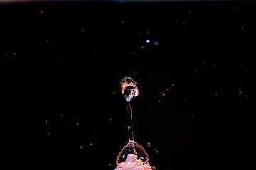 Obraz na płótnie Canvas High speed macro photography of a water drop splashing