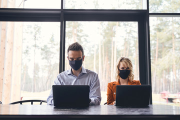 Two young people working in the office