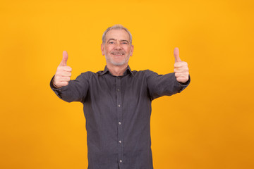adult or senior man isolated on background with okay expression