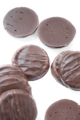 round chocolate cookies on a white background

