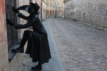 Costume plague doctor in the city streets