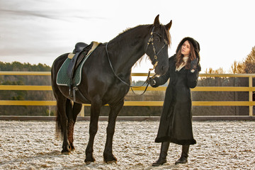 Obraz premium Pretty young girl with the horse