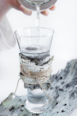 Birch juice poured into a transparent glass.
