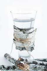 Birch juice poured into a transparent glass.
