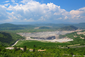 Fototapeta premium Surface ground charcoal exploitation. Industrial coal mining.