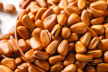 Pine nuts on a white board